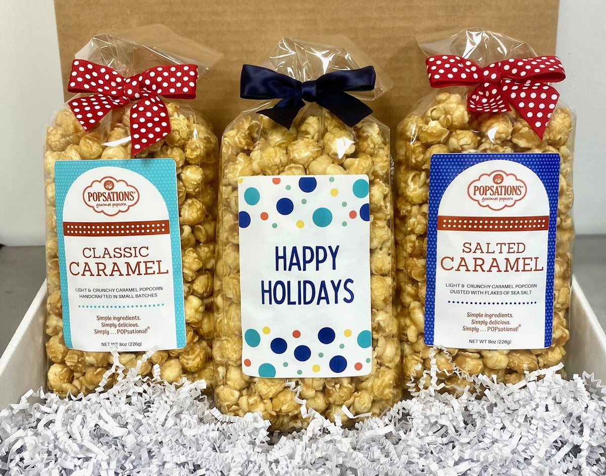 http://popsationspopcorn.com/cdn/shop/files/HappyHolidaysPopsationsGourmetCaramelPopcornGiftBox1_1200x1200.jpg?v=1690294796